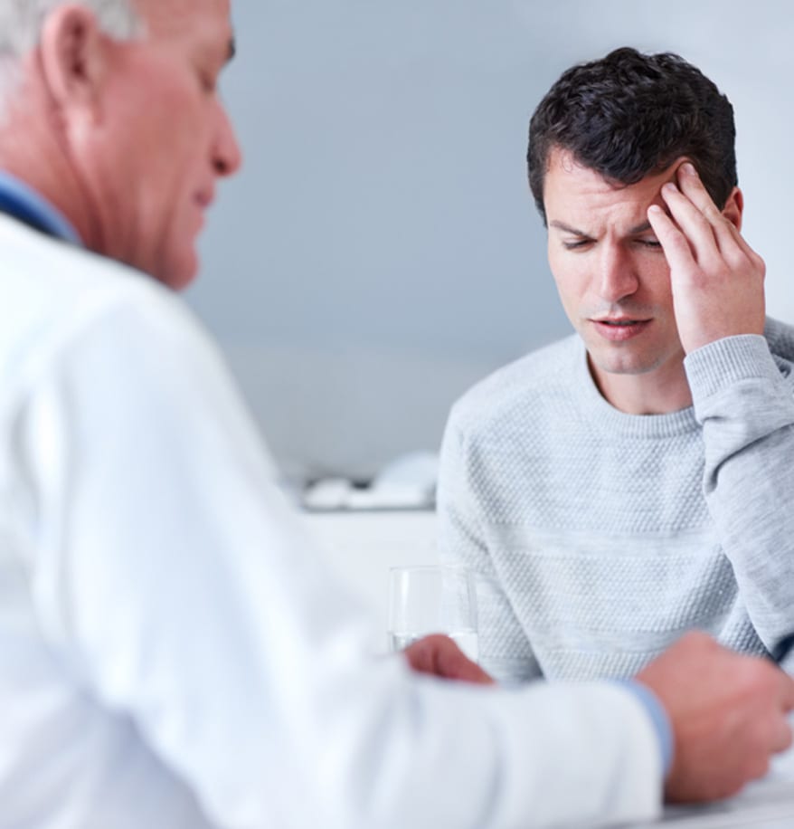 Patient-with-a-headache-visiting-his-physician