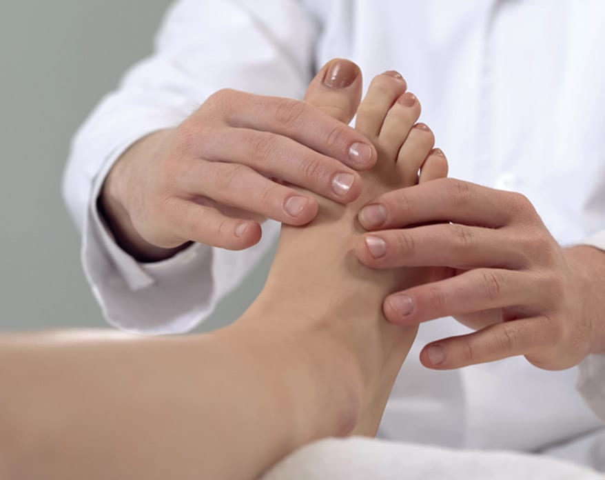 Doctor-examining-patient’s-foot-for-bunions