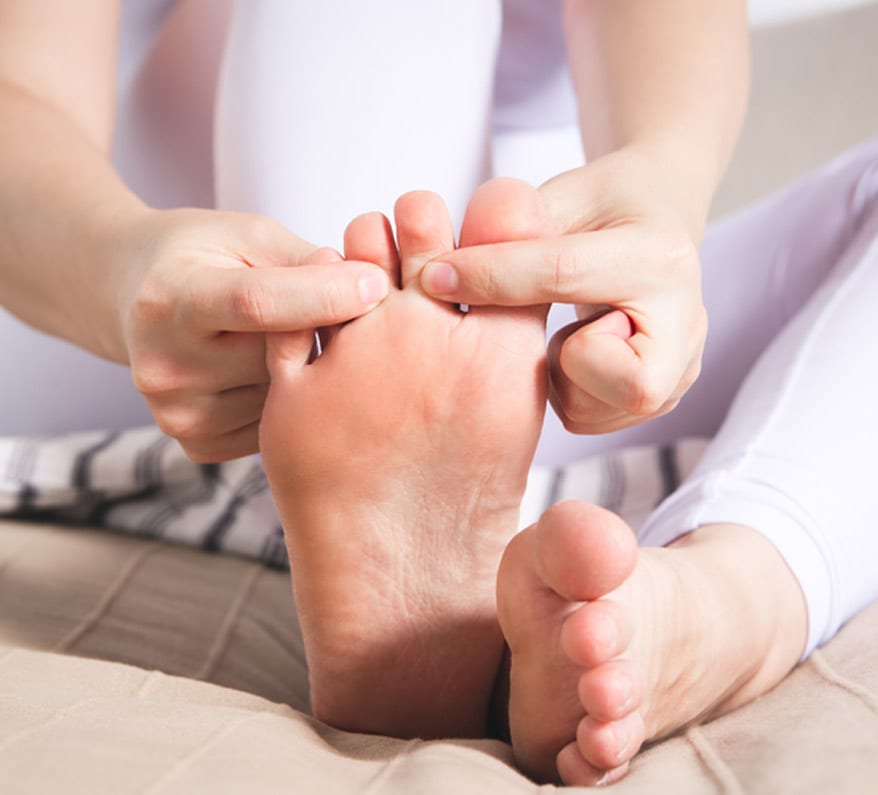 Woman-trying-to-relieve-pain-from-hammertoe