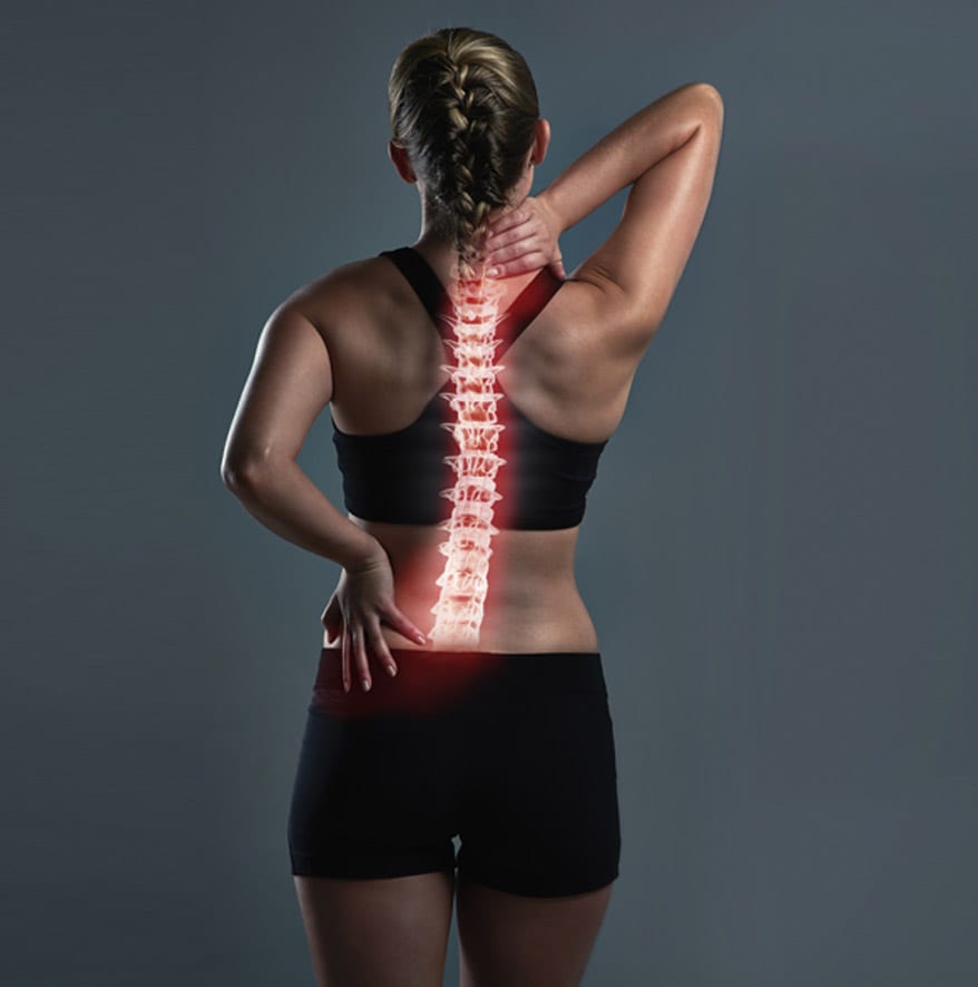 Athletic-female-touching-her-neck-and-lower-back,-needing-appointment-with-spine-surgeon-in-Orange-County